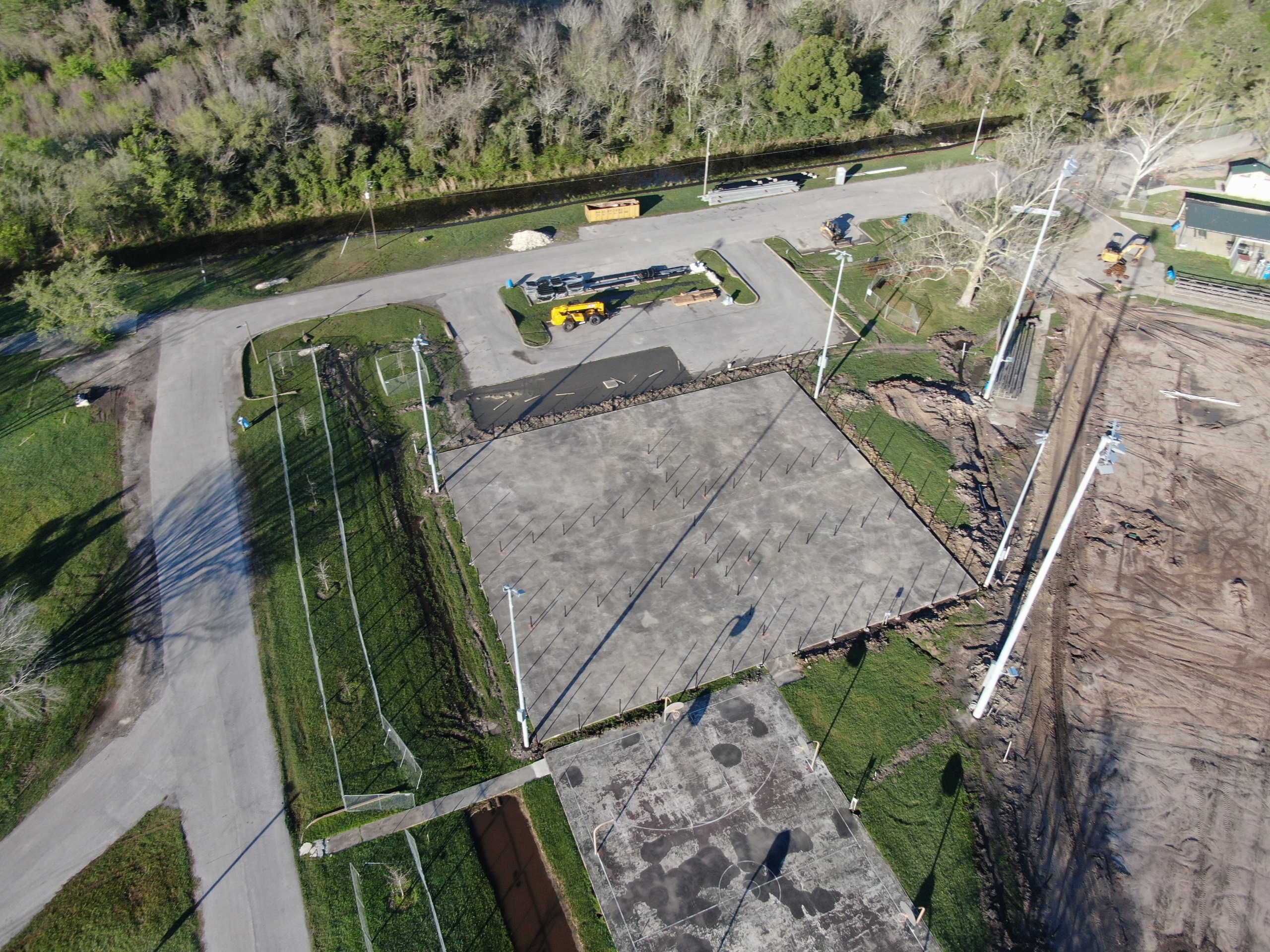 Arial image of the foundation for 6 pickleball courts in park 
